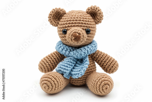 Amigurumi little teddy bear. Handicraft cute Crocheted doll. Isolated on white background.