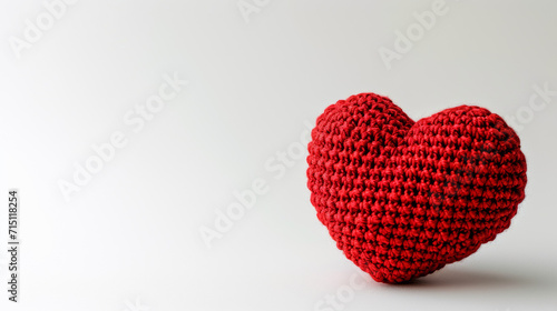 Amigurumi little heart. Handicraft cute Crocheted doll. Isolated on white background. Love symbol postcard  health concept or Valentine s day banner.