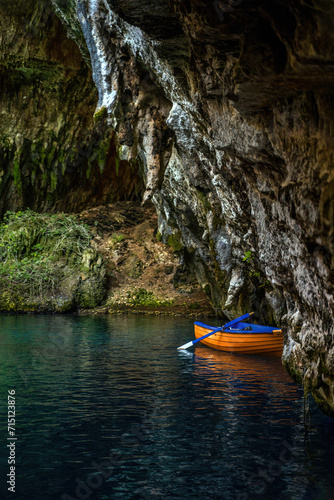 Zakynthos, Greece- A boat in the famous melissani lake on Kefalonia island photo