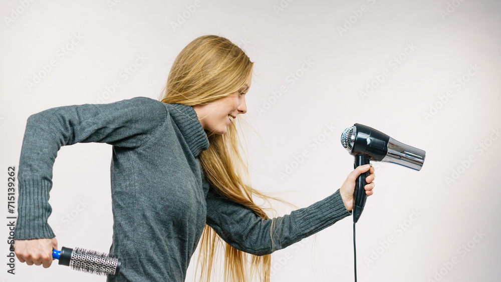 Girl holds hair accessories, styling hair Girl holds hair accessories, styling hair