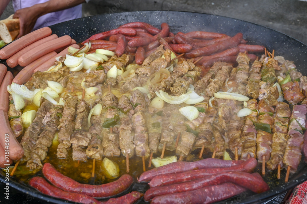 Skewers and sausages on the grill. Fast street food for sale. Fast foo. Skewers and sausages on the grill. Fast street food for sale. Fast foo.