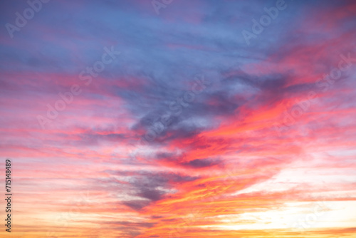 Beautiful , luxury Colorful soft gradient mix orange gold red and blue clouds with amezing line sunlight sky, perfect sky for the background, take in everning,Twilight, sky is about to form storm