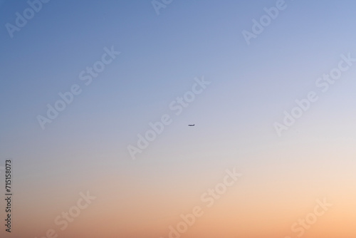 airplane in the air during sunset