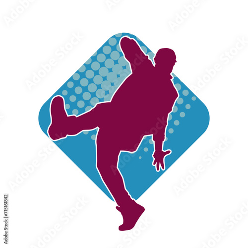 Silhouette of a slim man dancing pose. Silhouette of a male dancer in action pose.