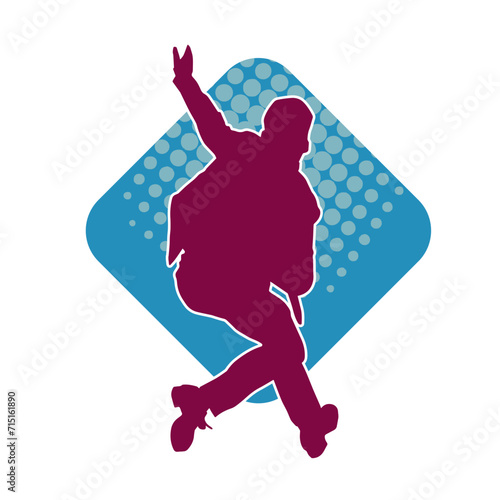 Silhouette of a slim man dancing pose. Silhouette of a male dancer in action pose.