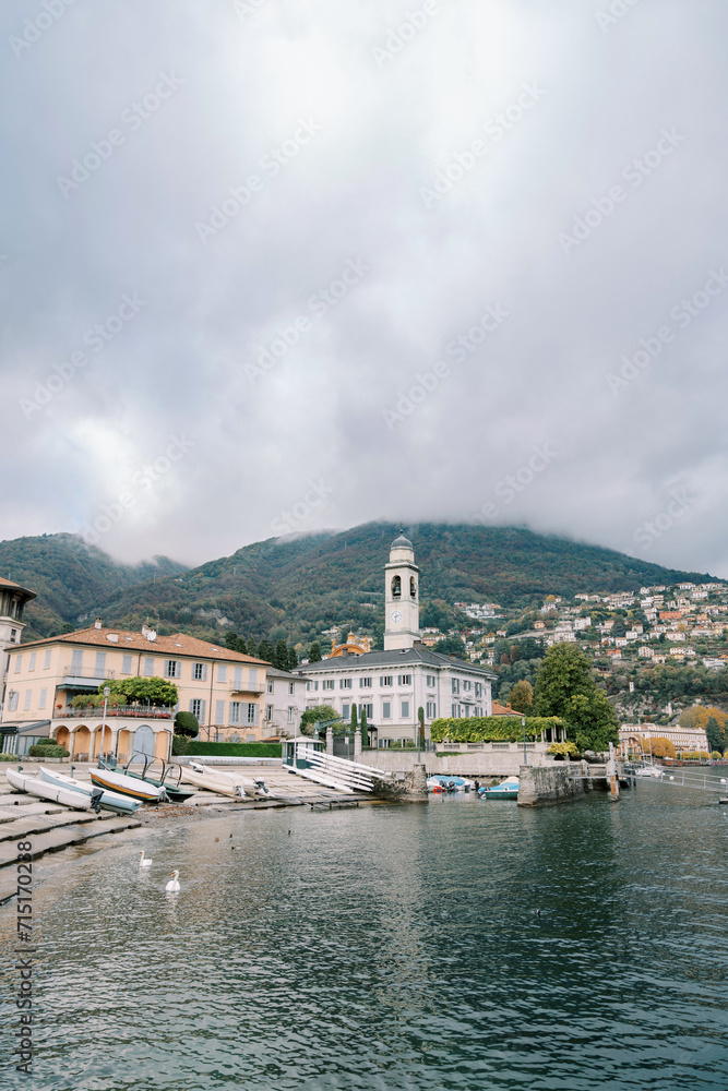 Bell tower of a church among ancient villas on the shores of Lake Como. Italy