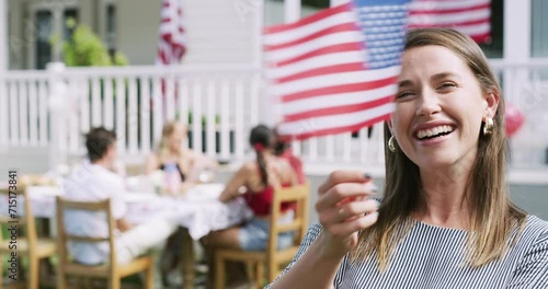 Woman, face and USA flag for patriotism in outdoors, democracy and celebration of independence. Female person, portrait and symbol of freedom, American citizen and happy on fourth of July holiday photo