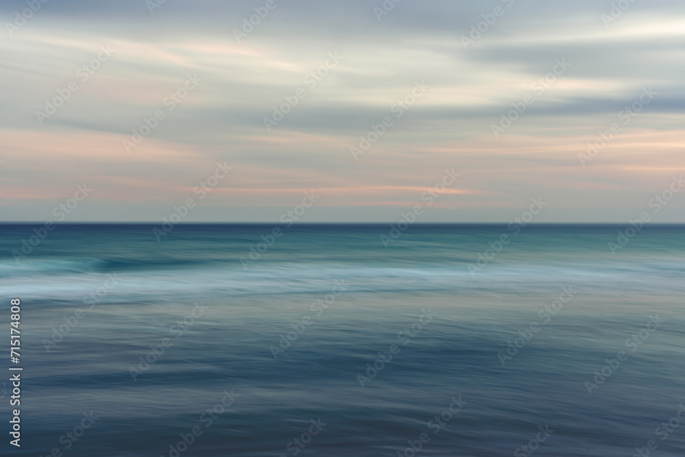 Ocean and cloudy sky, abstract seascape background, motion blur. Ocean and cloudy sky, abstract seascape background, motion blur.