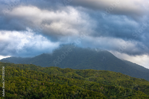 Heavy clouds over a dense forest, mountains of Bali near Munduk, Indonesia