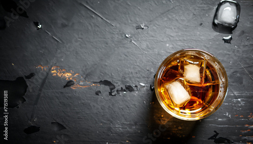 Whiskey with ice. Top view with copy space. high quality photo on a black background