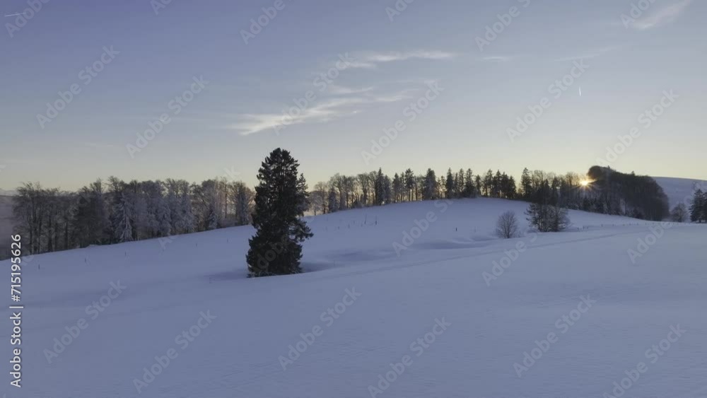 Low sun over the Jura mountains in winter with snow, depressions in the snow as geological formations, called sinkholes, Brunnersberg, second Jura mountain range, drone image, Matzendorf, Solothurn Low sun over the Jura mountains in winter with snow, depressions in the snow as geological formations, called sinkholes, Brunnersberg, second Jura mountain range, drone image, Matzendorf, Solothurn