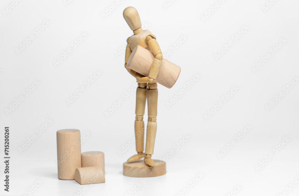 Wooden doll with wooden toy block isolated on white background. business or creative concept Wooden doll with wooden toy block isolated on white background. business or creative concept