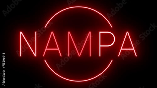 Flickering red retro style neon sign glowing against a black background for NAMPA photo