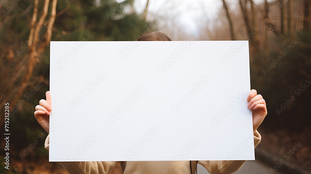 A person holding a blank white board, A person holding a blank white board,