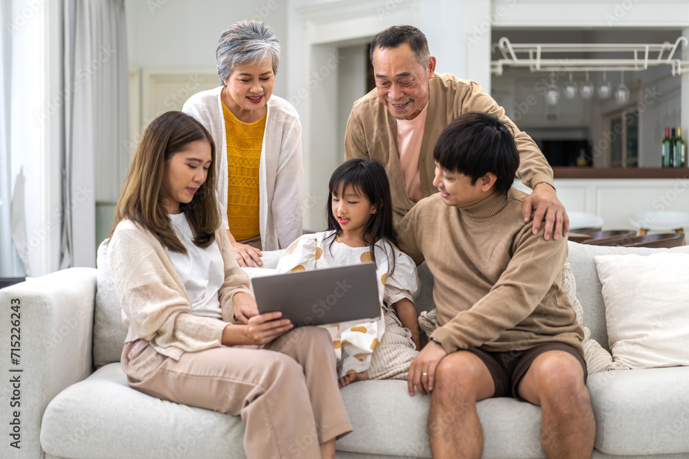 Father and mother with asian kid girl learn on laptop computer reviewing lesson study with online education e-learning.student look for educational knowledge in homeschool at home.Education. Father and mother with asian kid girl learn on laptop computer reviewing lesson study with online education e-learning.student look for educational knowledge in homeschool at home.Education.