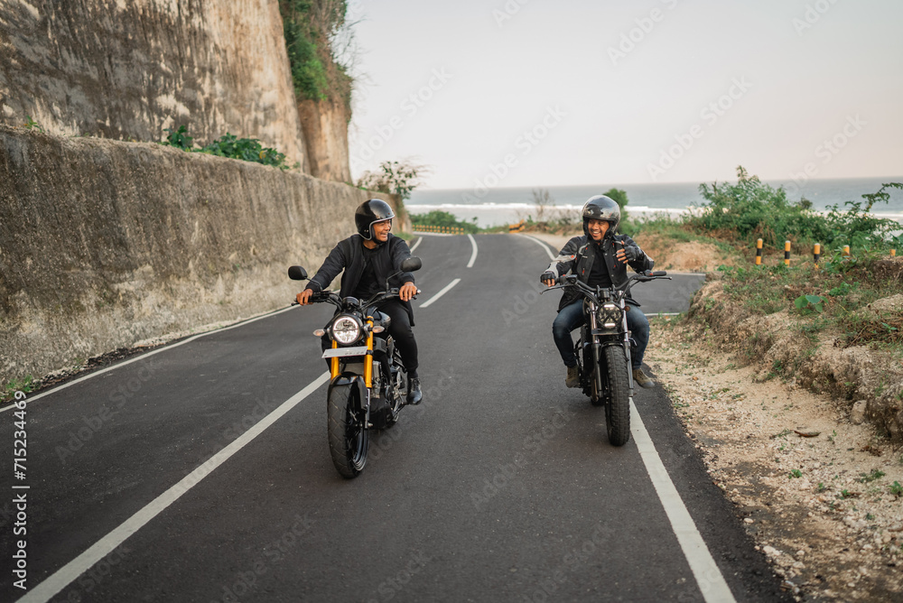 indonesian adult men on motorcycle trip with friend indonesian adult men on motorcycle trip with friend