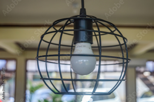 a lamp with a Japanese-style ring
