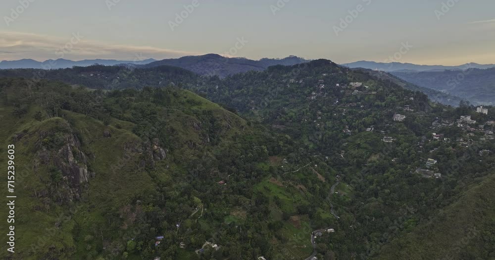 Ella Sri Lanka Aerial v14 cinematic drone flyover verdant valley capturing mountainous landscape and small village town nested on hilly terrains at dawn - Shot with Mavic 3 Cine - April 2023 Ella Sri Lanka Aerial v14 cinematic drone flyover verdant valley capturing mountainous landscape and small village town nested on hilly terrains at dawn - Shot with Mavic 3 Cine - April 2023
