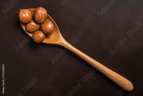 Generative AI Image of Top View of Hazelnuts in a Wooden Spoon on Dark Background