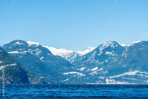 ocean view with mountains, blue sky © karamysh