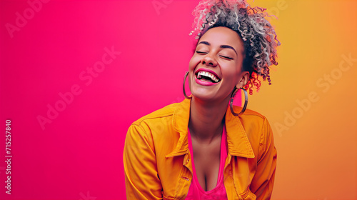 Woman With Curly Hair Laughing and Wearing Yellow Jacket