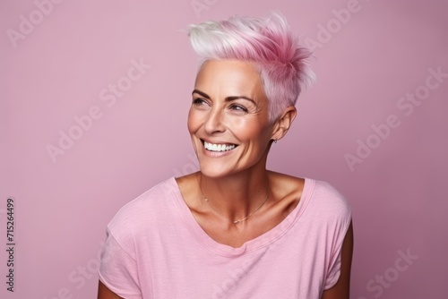 Portrait of a beautiful woman with pink hair on a pink background