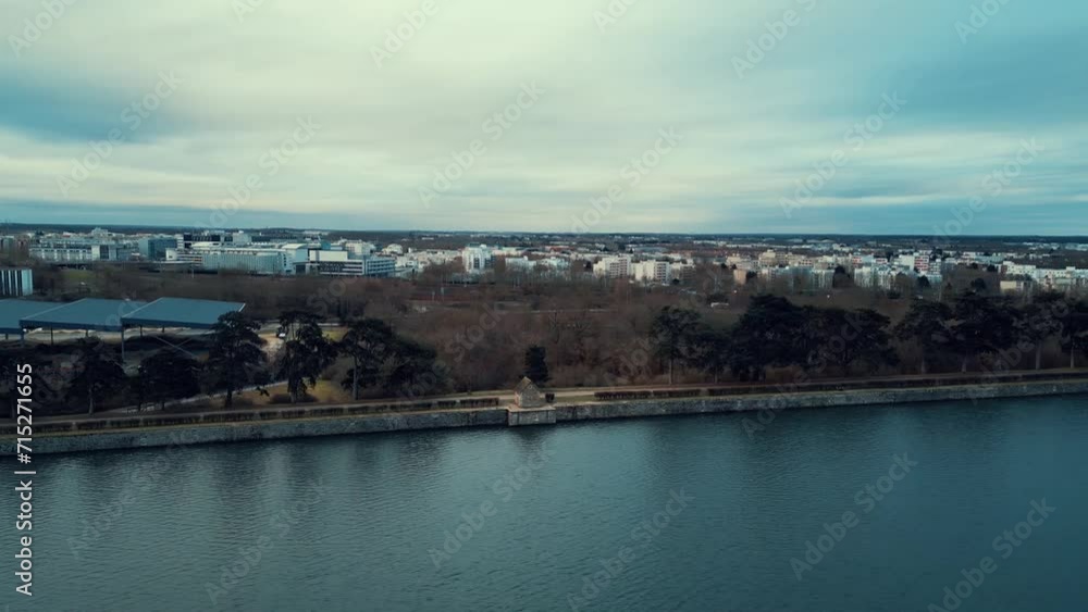 Drone view of this pond which contributes to the regulation of the water cycle and the preservation of aquatic ecosystems. As wetlands, ponds act as natural filters, improving water quality