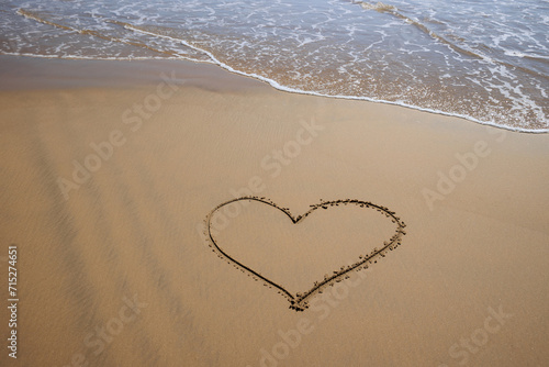 Heart shape drawn on the beach