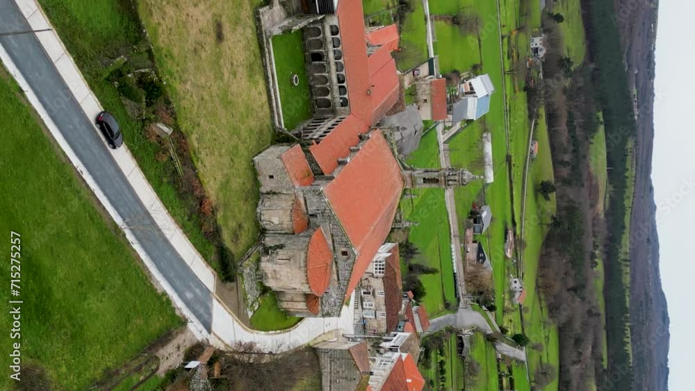 Vertical orbit around Santa Maria de Xunqueira monastery and historic courtyard Vertical orbit around Santa Maria de Xunqueira monastery and historic courtyard