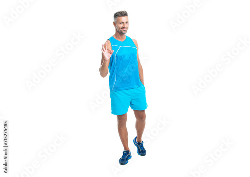 fit and sporty athletic sportsman man in workout sportswear show ok isolated on white studio background