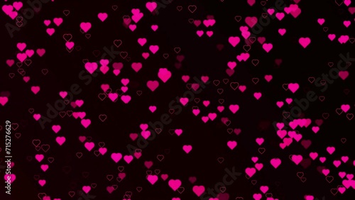 Large group of small red heart shapes in the shape of a big Valenitines day heartfelt projects. heart on red colored bokeh motion background. photo
