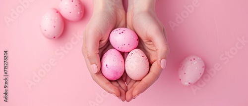 Woman's hands gently cradle a pastel pink painted Easter egg, Ai Generated. photo