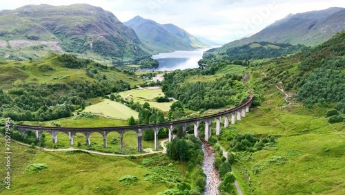 Wallpaper Mural Drone Scotland 4k. Aerial view Glenfinnan viaduct bridge, on which famous Jacobite train runs in Scotland. Jacobite Railway scenic tourism attraction in Britain.  Torontodigital.ca