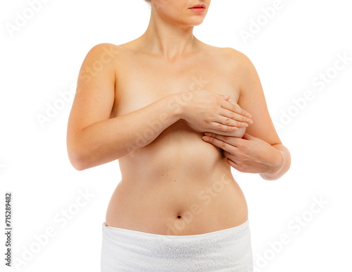 Woman examining breast isolated on white background
