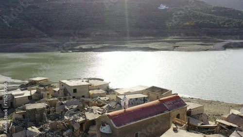 Sfentyli is an abandoned village which is sinking every winter when the dam of Aposelemi gets filled with water, Crete, Greece. photo