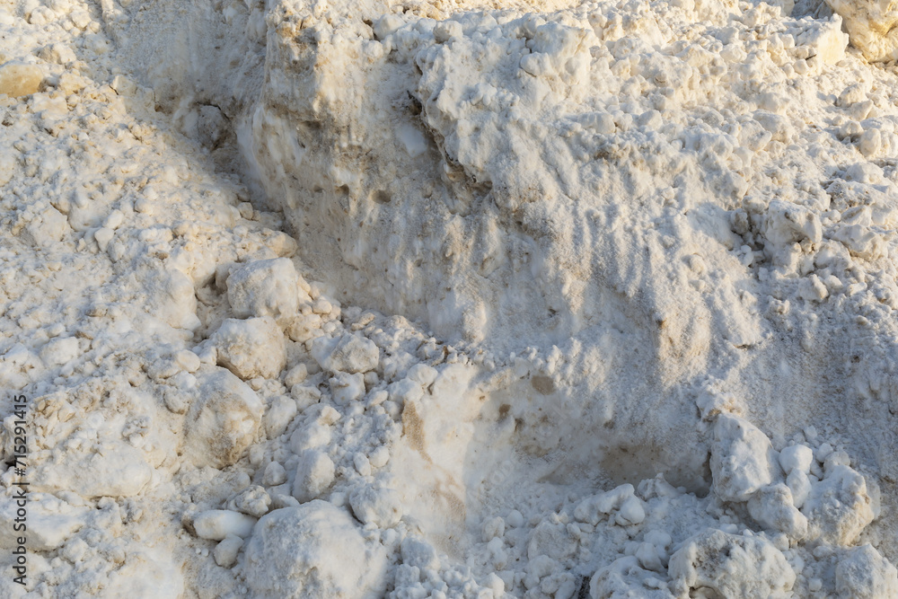 Dirty snow mixed with sand, background texture Dirty snow mixed with sand, background texture