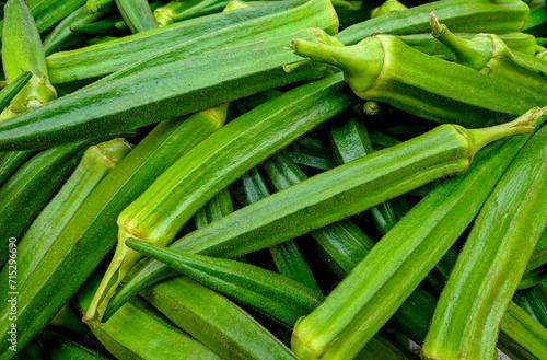 Fresh okra on the market in India. Close-up. photo