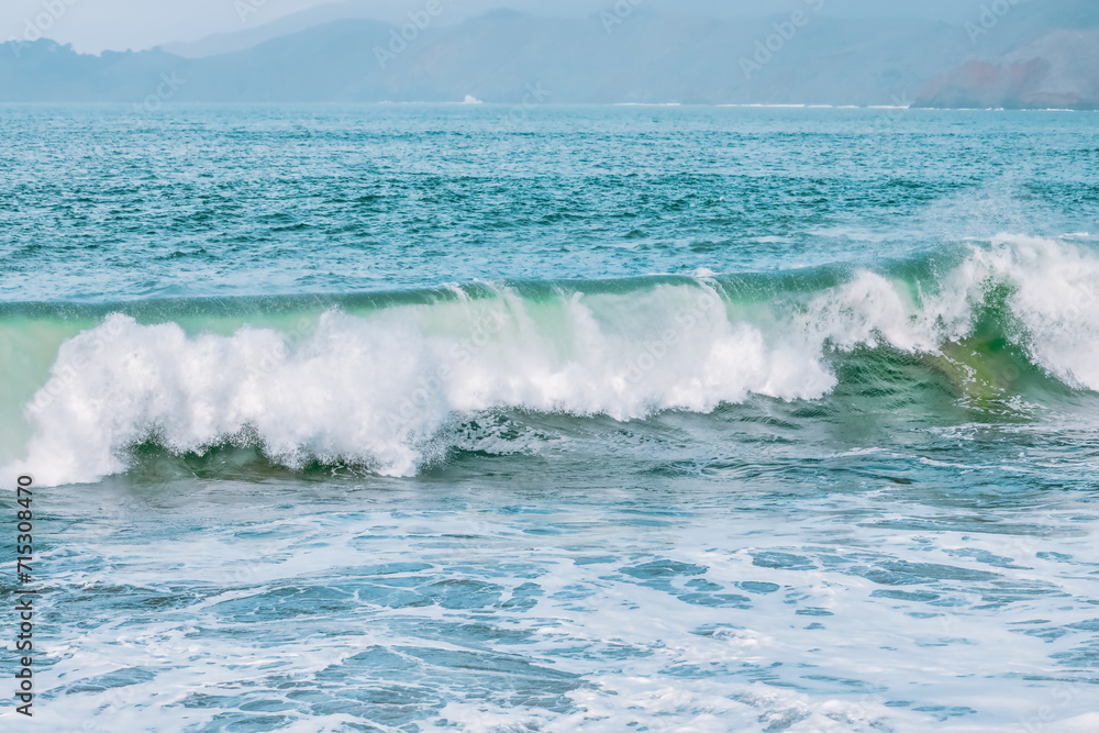 Wave splashing close-up. Crystal clear sea water, in the ocean in San Francisco Bay, blue water, pastel colors. Wave splashing close-up. Crystal clear sea water, in the ocean in San Francisco Bay, blue water, pastel colors.
