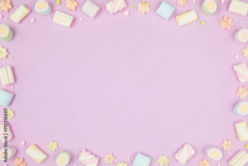 Cute pastel purple kawaii background with frame of sweet meringue and marshmallows . Flat lay, top view, copy space. Beautiful childlike design template Cute pastel purple kawaii background with frame of sweet meringue and marshmallows . Flat lay, top view, copy space. Beautiful childlike design template