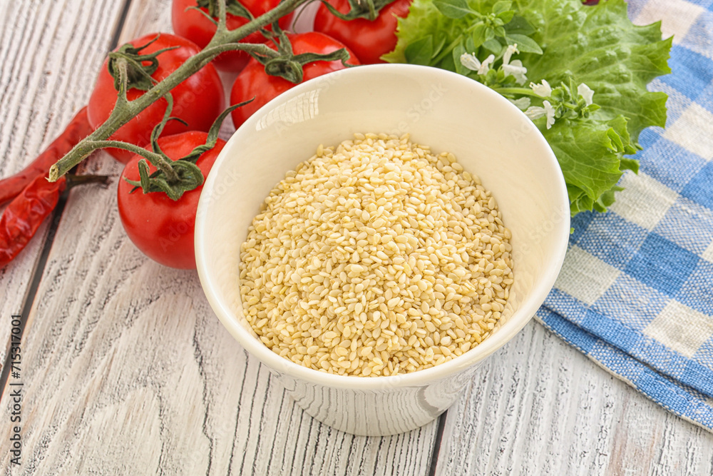 Raw sesame seeds in the bowl Raw sesame seeds in the bowl