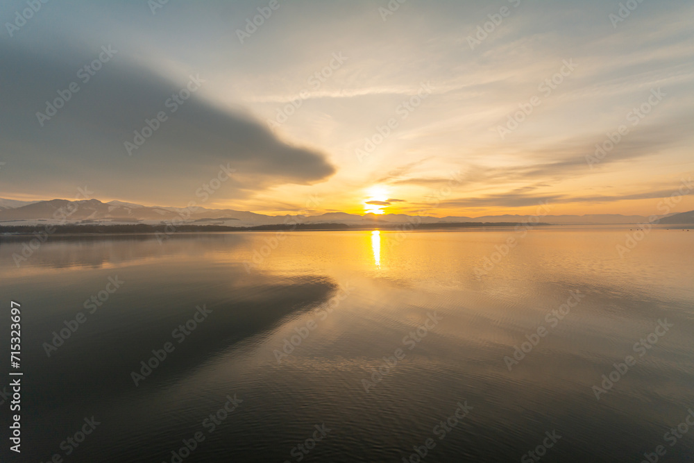 Obraz premium Sunset over the Liptovska Mara reservoir, Slovakia.
