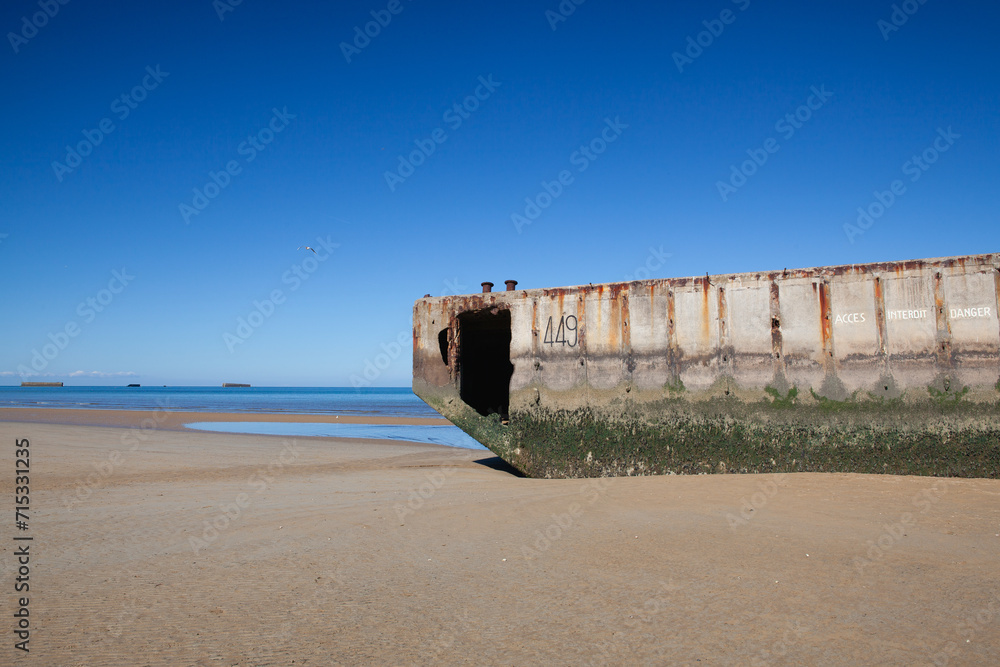 Arromanches beach with rusting floating pontoons, Normandy