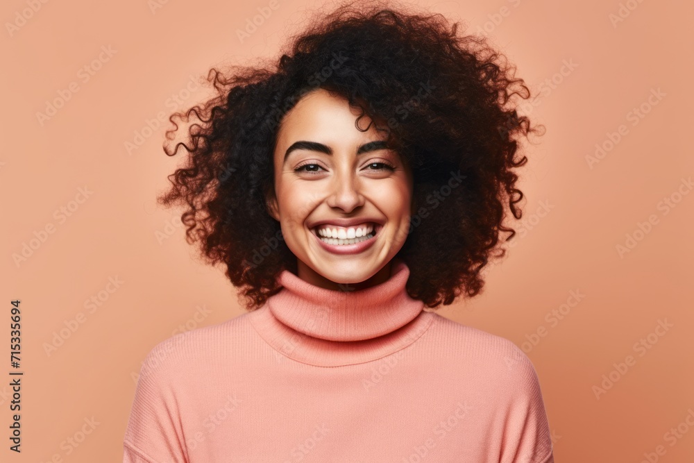 Beautiful african american woman with curly hair smiling at camera Beautiful african american woman with curly hair smiling at camera