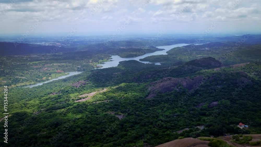 beautiful drone shot of Savandurga hills, it is situated at 60 km west of Bengaluru, Karnataka, India. It is the largest monolith hills in Asia famous for trekking, rock climbing & a pilgrim. beautiful drone shot of Savandurga hills, it is situated at 60 km west of Bengaluru, Karnataka, India. It is the largest monolith hills in Asia famous for trekking, rock climbing & a pilgrim.