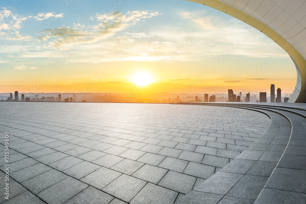 Empty square floor and city skyline scenery at sunset. High Angle view.