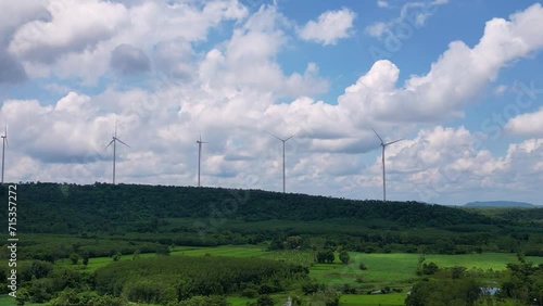 Wind turbines produce electricity on top of the mountain.
