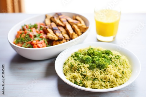 broccoli rice with grilled chicken strips on side