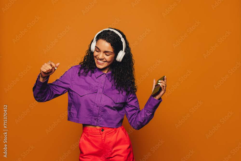 Movin' and groovin' with vibrant colors on a orange background Movin' and groovin' with vibrant colors on a orange background