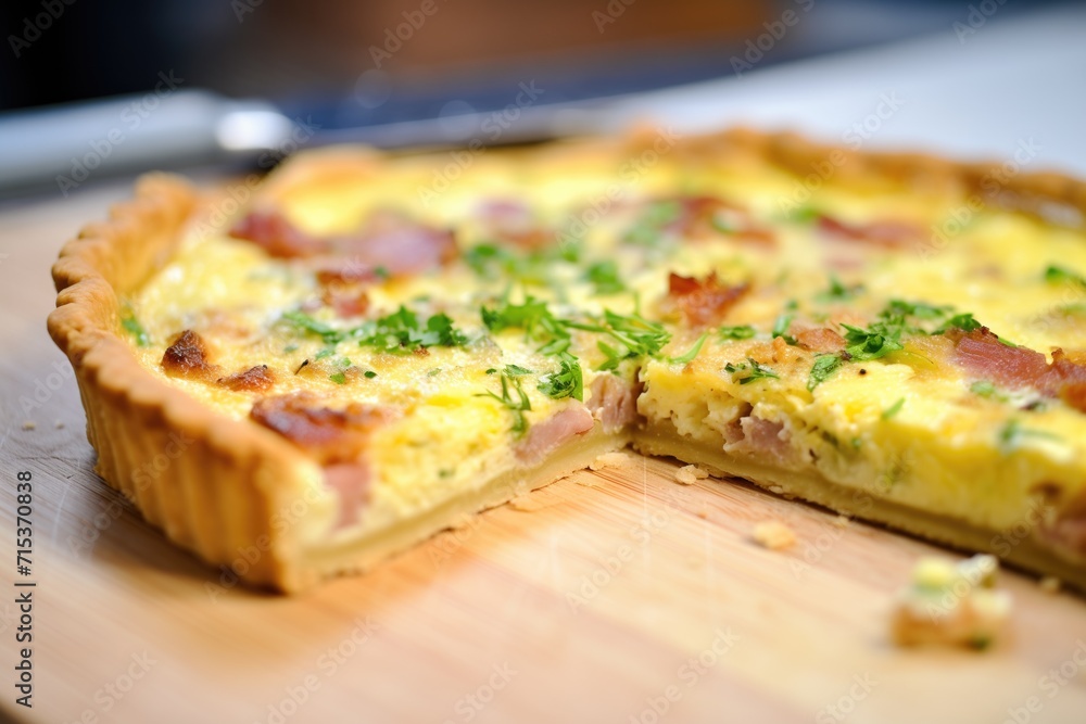 open quiche lorraine with a flaky crust close-up
