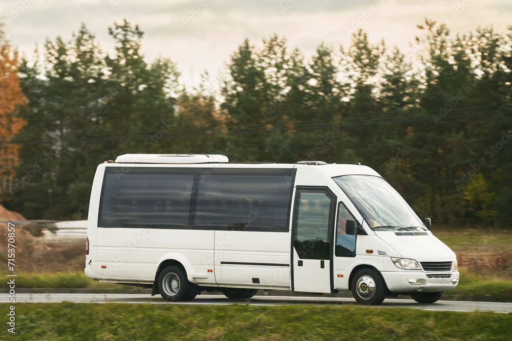 Travel in Comfort and Style with This Modern White Coach on the Road.